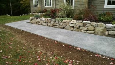 Stamped concrete walkway with Stone textured stamp
